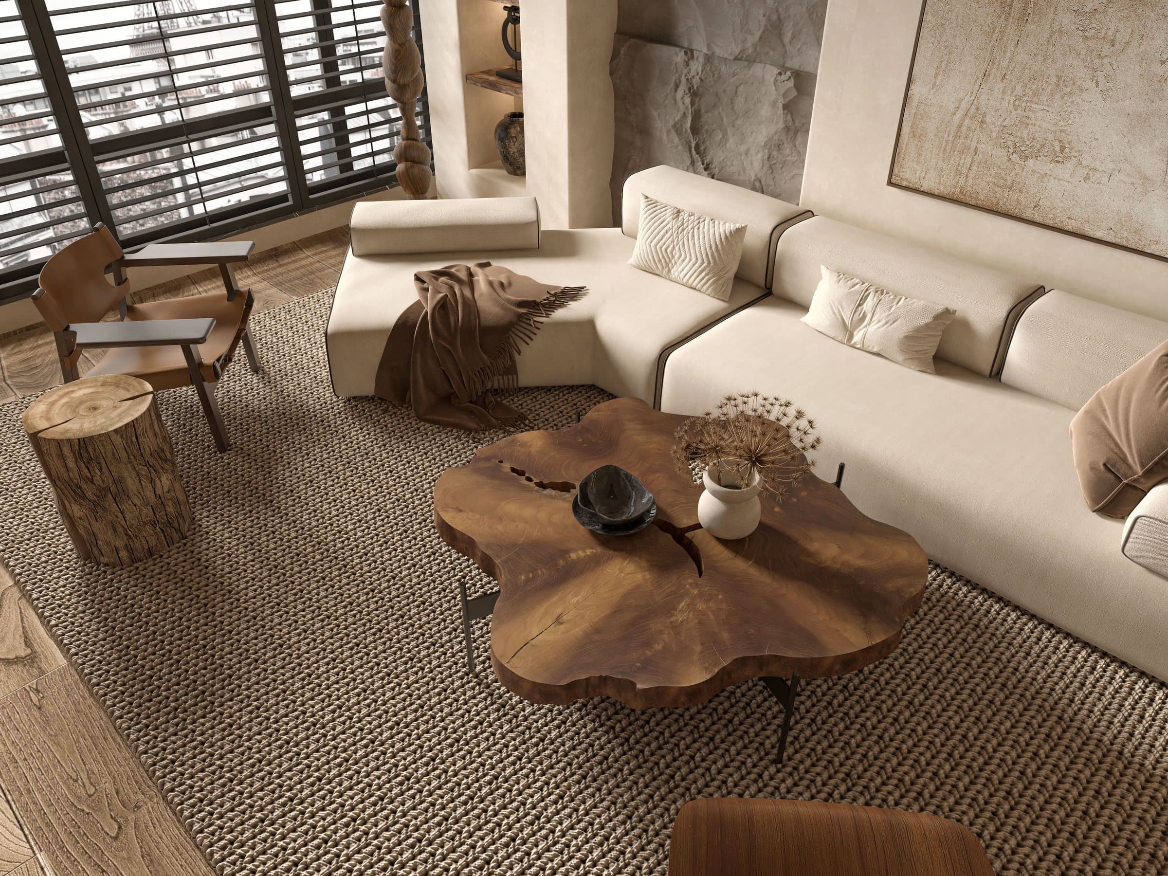 A clean, freshly styled living room with an upholstered sectional sofa and a woven area rug.